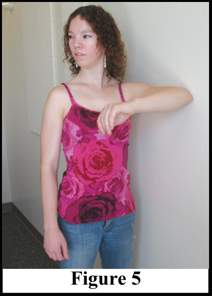 Photo showing how to use the wall to tone arm muscles.