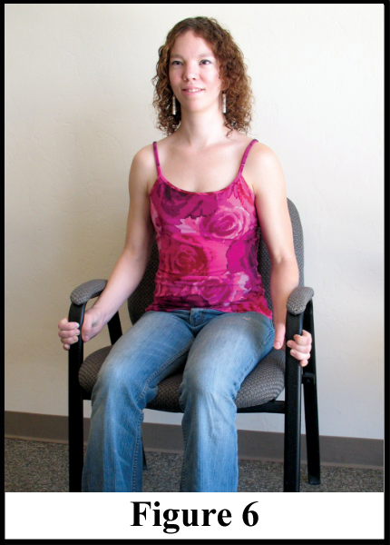 Photo showing how to use the arms of a chair to strengthen arm muscles.
