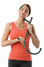 Photo of a woman using a Thera Cane for treating neck pain.