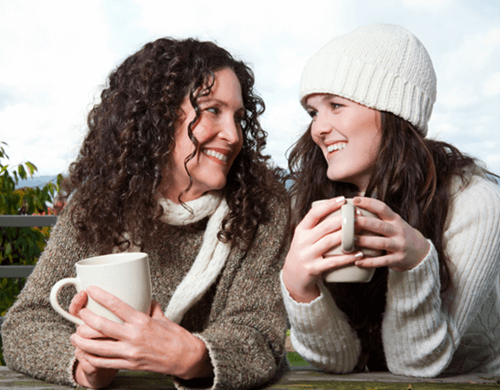 Photo of two patients talking and supporting each other.